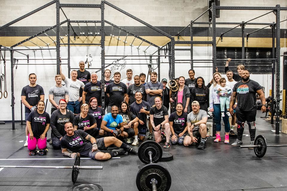 Grounded CrossFit members and coaches together on the gym floor in Hanover, Maryland