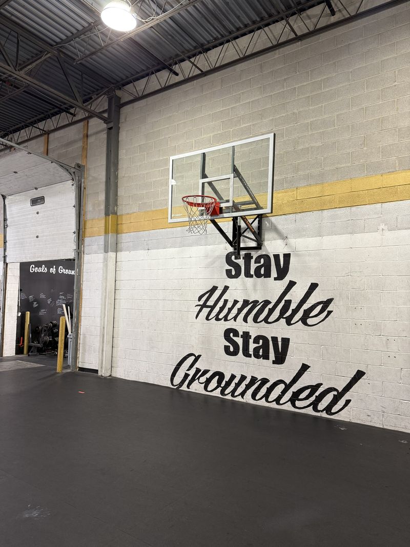 The Stay Humble Stay Grounded mural on the wall at Grounded CrossFit